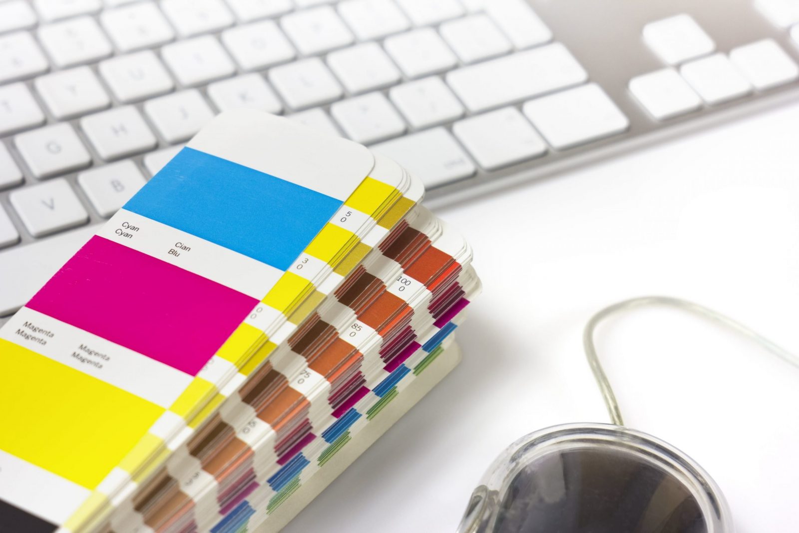 Colour Swatch Book On Graphic Designer's Desk