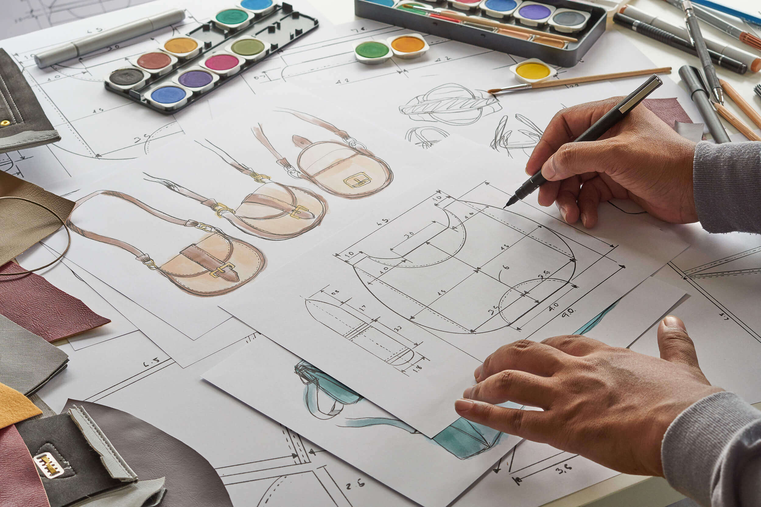 fashion-designer-sketching-handbag-aalofts-design fashion-designer-sketching-handbag-aalofts-design