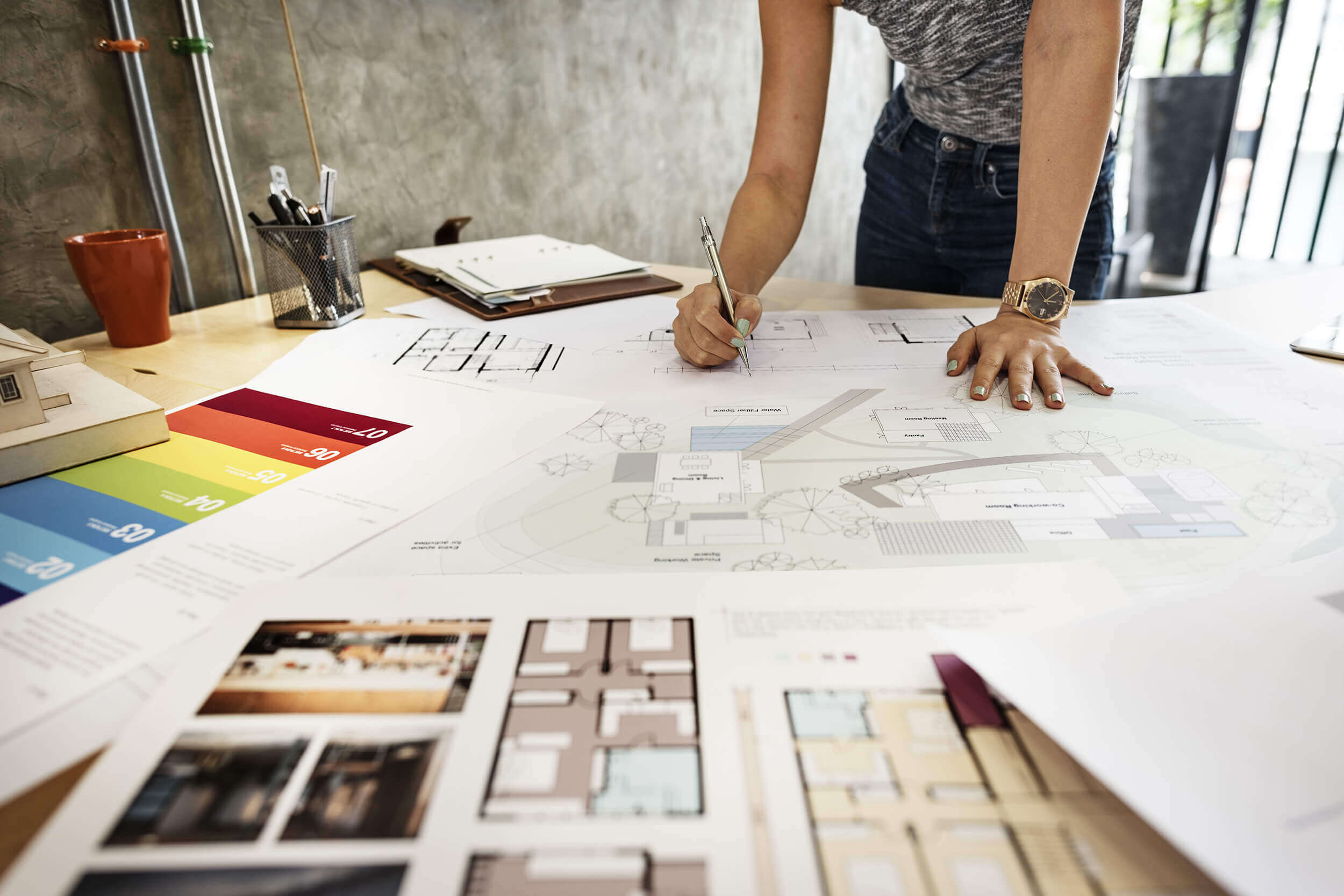 interior-designer-working-construction-drawings-aalofts-design Interior Designer Working on Construction Drawings